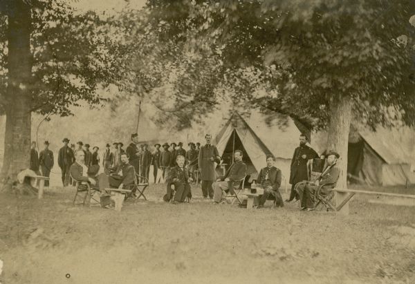 The headquarters camp and officers of the 16th Wisconsin Volunteer Infantry in Tennessee. The officer seated on the far right is thought to be Cassius Fairchild, who entered the war as a major and was promoted to colonel in March, 1864.