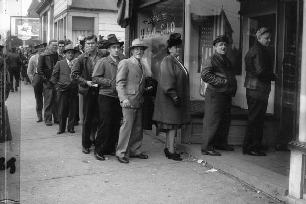 Members of the United Automobile Workers union, Local 75, line up outside the local's headquarters, 308 E. Center Street, to vote on delegates to the union's convention. Local 75 represented workers at the Seaman Body Corp., a subsidiary of Nash Motors.