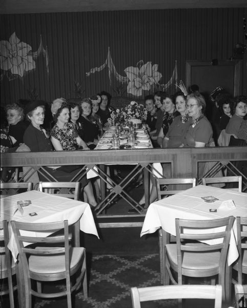 Officers of Auxiliary No. 2, United Automobile Workers (Seaman Body Company) celebrate their thirteenth anniversary at the Tic Toc Club. 
Left to right: Katherine Meyer, vice-president; Jeanetta Kim, recording-secretary; Mary Schmidt, sergeant-at-arms; Martha Parbs, trustee; Ann Speth, past president; Eleanor Borowski, planning committee chairman; Henrietta Karrer, president; Ann Steffes, guide; Clementine Steffes, financial secretary; Loraine Selky, trustee; and Teresa Goes, trustee.