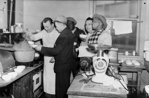 Strike kitchen of Local 50, United Packinghouse Workers of America (Plankinton Packing Company).  Left to right: Al Herold (chef), Ernie Bernie, Jimmy Glover, Joe Catanese, and Henry Cabell.<p>The United Packinghouse Workers had one of best records of any union on racial issues. In 1948, 83% of UPWA locals had African American stewards, and 73% had African Americans on their executive boards.</p>