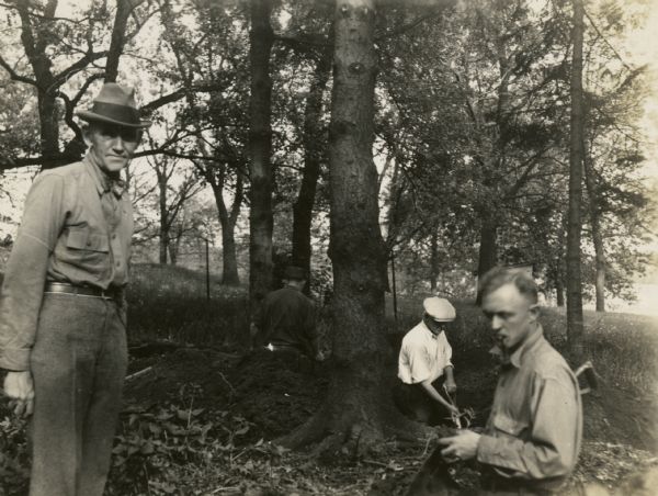 Charles E. Brown (left), directs excavation of a goose effigy mound at the Willow Drive mound group on the University of Wisconsin-Madison campus.