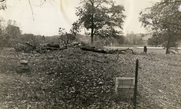 A linear burial mound and historic marker at the University Ridge mound group on the University of Wisconsin-Madison campus. The mound group was eventually destroyed by plowing, the creation of an experimental orchard, and the construction of the U.S. Forest Products lab.