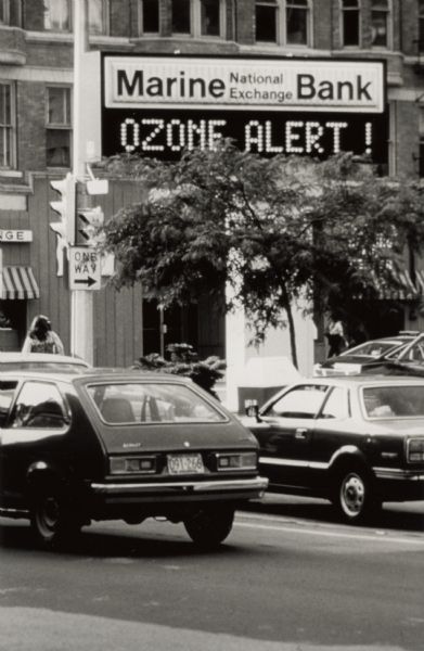 On hot summer days, automobile emissions cause an increase in ground level ozone that can be harmful to health. In Wisconsin, the ozone problem is most acute in the cities along Lake Michigan between Milwaukee and Chicago.  Wisconsin posts an ozone alert when average concentrations over a four hour period average 100 ppb.