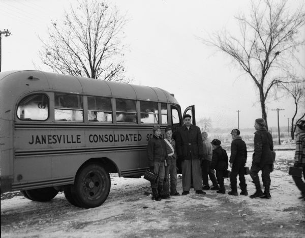School Bus Stop, Rural Rock County, Wisconsin Rural Rock County students boarding a bus for the Janesville consolidated schools.
