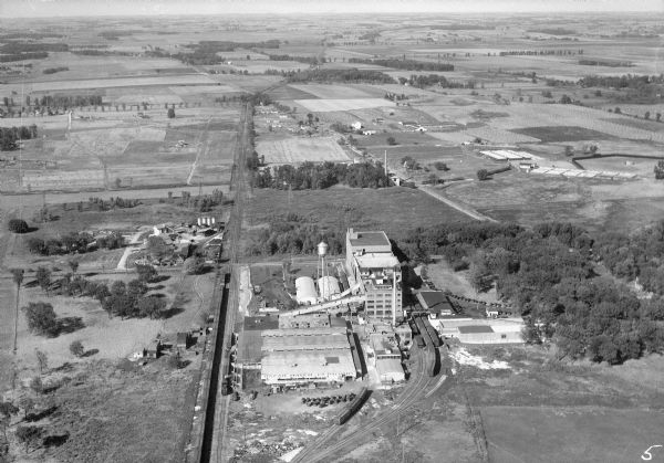 Aerial view of the Oscar Mayer meat packing plant, looking north, with the surrounding rural countryside.