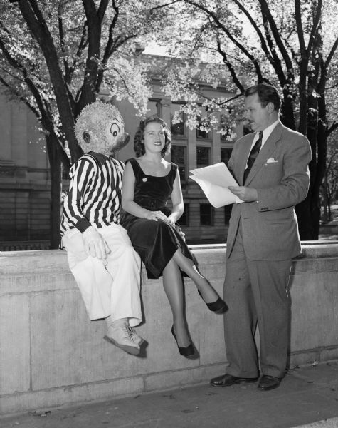 Walt Kelly posing with a person dressed as Pogo, his cartoon creation, and Jo Ingelfield, who was selected to be Pogo's first lady if he successfully won his candidacy for president of the swamp.