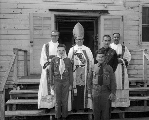 Three Madison Boy Scouts received the Ad Altare Del medal at a retreat at the Dane County fairgrounds. Left to right: Reverend Wayne Turner, Tim Harrington, John Doyle, Bishop O'Connor, Richard O'Connor and the Reverend Bernard Meloy.