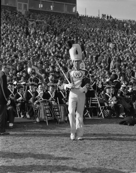 Drum major, Stan Stitgen, in front of the University of Wisconsin-Madison marching band at the Wisconsin - Illinois football game in Camp Randall Stadium.