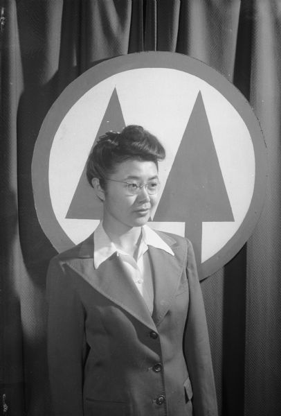 Portrait of Ruby Kubota, president of Groves Housing Co-op of the University of Wisconsin. Her father, George Kubota, came to the United States from Japan when he was 15 and settled in Metaline Falls, Washington. After working long hours in a laundry, he bought property and became a well-known resident of Metaline Falls. His daughter, Ruby, submitted many articles and letters to the local newspapers and won an 5,000 word essay contest of the American Legion on the subject of Americanism. She is a freshman journalism student at the University of Wisconsin.
