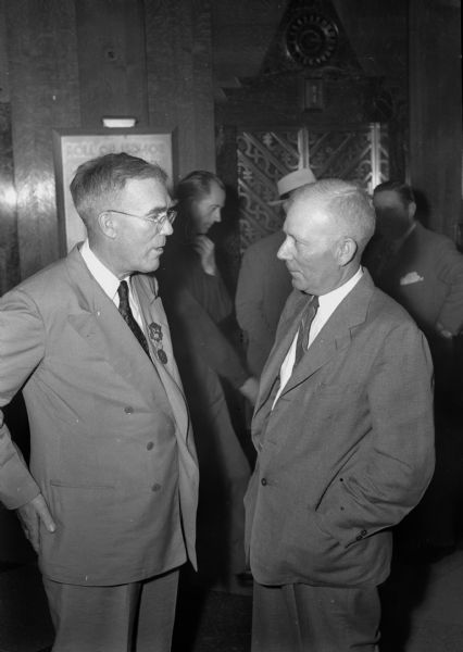 Two Wisconsin delegates to Republican Party National Convention in Chicago, Illinois.  Assemblyman Ernest Heden, Ogema (left), and Orin Angwall, Marinette (right). Both are Dewey delegates.