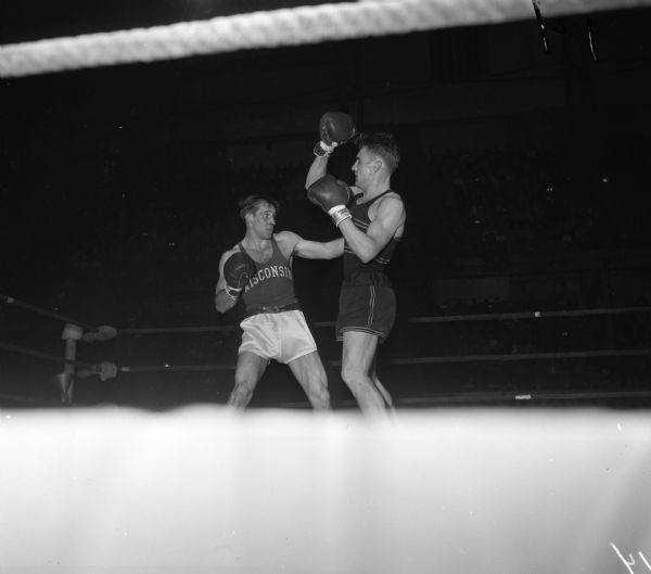 University of Wisconsin boxer Dan Dickinson (left) competing against Maryland's Ed Rieder at the National Collegiate Athletic Association national tournament at the University of Wisconsin-Madison Field House.