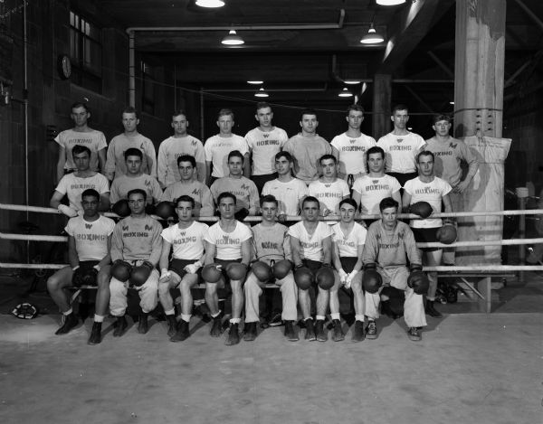 Group portrait of 25 University of Wisconsin boxers just prior to a workout in the Camp Randall training quarters where they are preparing for the 14th annual Tournament of Contenders finals.  Elimination bouts at Camp Randall training quarters will cut the field to 16 finalists.