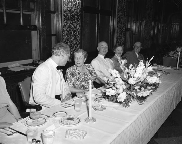 Dr. Sigfrid Prager, retiring conductor of the Madison Civic Symphony orchestra and Madison Civic Chorus, Farewell Dinner. Left to right are honoree Dr. Sigfrid Prager; Mrs. L.M. Hanks, one of the founders of the Madison Civic Music assn.; Prof. Leland Coon, chairman of the University of Wisconsin music school; Mrs. Prager, E.J. Frautschi, member of the Madison board of vocational and adult education co-sponsor with the association of the orchestra and chorus.