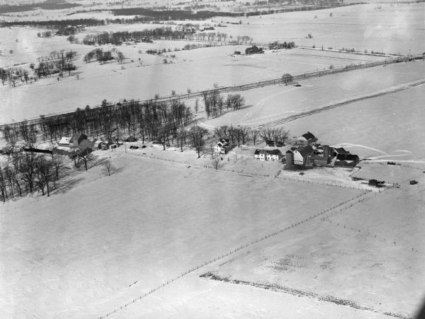 Aerial View of Blaney Farm One of four aerial views of the Edwin Blaney farm and farm buildings surrounded by snow-covered fields. Four miles south of Madison and a mile west of U.S. 14.