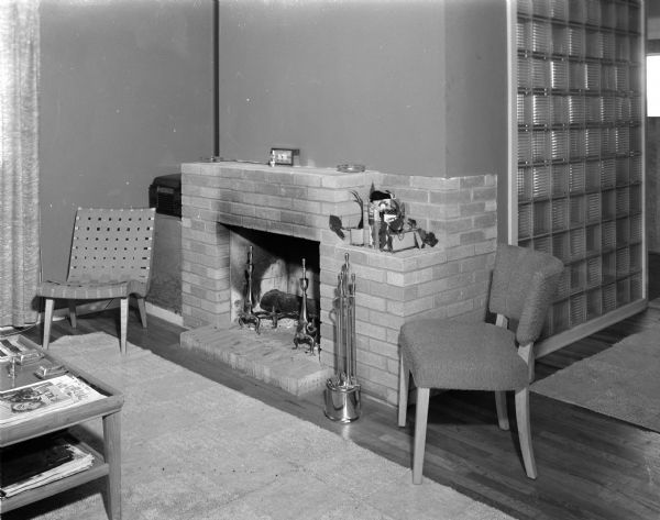Interior of the Keith Roberts House The fireplace in the home of Mr. and Mrs. Keith Roberts, 13 South Midvale Boulevard, one of four homes designed and constructed by Marshall Erdman for war veterans with small families. The asymmetrical fireplace and a glass brick wall divide the kitchen and dining areas.