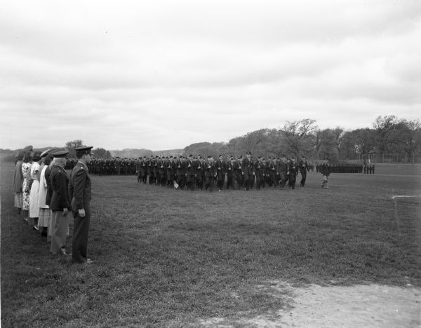 A three day annual inspection of the University of Wisconsin Reserved Officers Training Corps cadets was climaxed by a parade of 2,500 cadets and the presentation of yearly awards on the intramural playing fields.