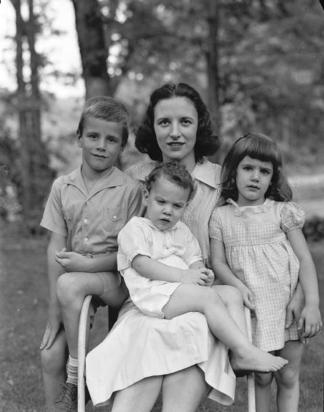 Mrs. Greggar Sletteland & Children Portrait of Mrs. Greggar (Virginia McCormick) Sletteland and her children Greggar, age 7; Margaret, age 4; and Thomas, age 2.