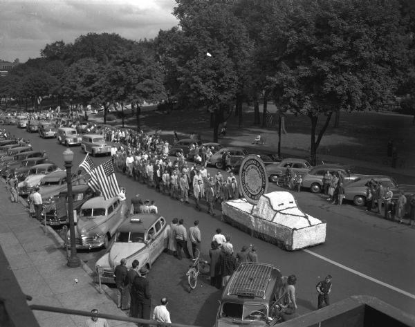Elevated view of Madison's Labor Day parade, showing the electrical workers' unit, the largest unit in the parade, and the Brotherhood of Electrical Workers float.