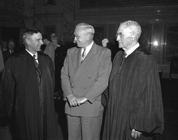Group portrait of newly sworn-in Justice of the Supreme Court, Timothy Brown, at left, with Governor Oscar Rennebohm, center, and Chief Justice Marvin B. Rosenberry, at right.