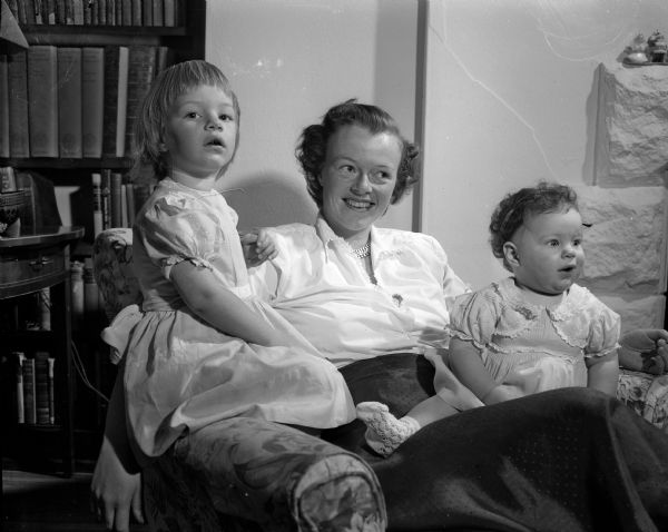 Mrs. Louis E. (Helen) Stephens and Her Two Daughters Portrait of Mrs. Louis E. (Helen) Stephens of Somers, Westchester County, New York and her two daughters, Elizabeth (left) and Alison. The family is visiting Mrs. Stephens's parents, Professor and Mrs. Norris F. (Alice) Hall, 1101 Lincoln Street.