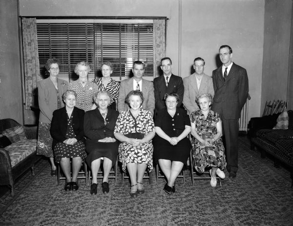 Odd Fellows and Rebekahs Fall Festival Group portrait of some of the committee members making arrangements for the fall festival and "fun night" sponsored by the Odd Fellows and Rebekahs. Seated in the front row left to right: Mmes. Mary Jayne Rule, E. J. Warnish, Earl Siggelkow, Carl Jorgenson, and Harry Droberg. Standing left to right: Mrs. C.E. (Faye) Gibson, Mrs. C.E. (Mabel) Kramer, D.K. Watson, F.H. Stamper, K. Hanson, and M. Vogel.