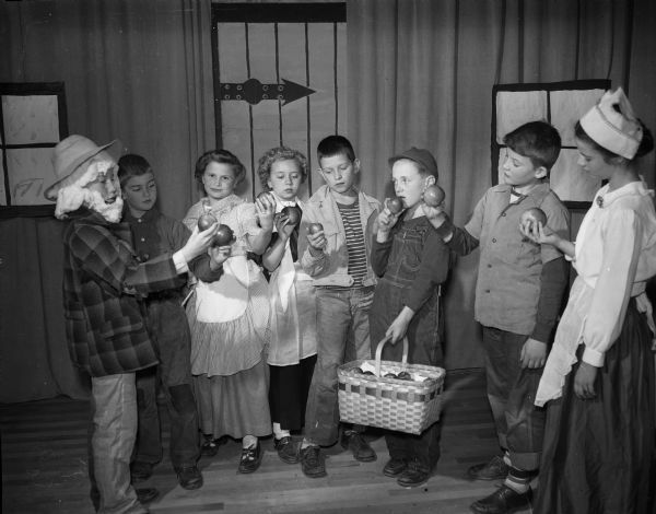 Johnny Appleseed Play A scene from the Lapham School fifth grade production of Johnny Appleseed. Shown are, left to right: Bob Alcumerac (Johnny), Bill Mueller, Nancy Hustad, Louise Hehn, Keith Hewitt, Dennis Crary, John Jensen, and Rosemary Reding.