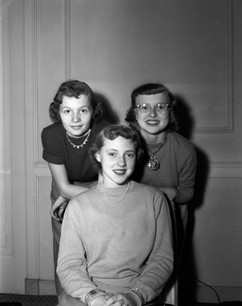 Rainbow Girls Dance Portrait of three members of the Masonic Order of Rainbow for Girls who are planners for the "Skirt and Sweater Frolic" dance. Left to right: Dyanne Wedlake, Sharon Halvorson, and Mary Alice Lyon.