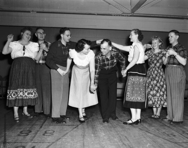 The fourth annual Mid-Winter Square Dance Jamboree was held at the Madison Community Center, located at 16 East Doty Street. Square dancing is held every Thursday night from 7:30 to 10:30. Pictured from left to right are: Mr. and Mrs. Ray Hahn, Richard Mann, Pauline Coles Haight, William Bilderback, Helen Coakley and Jane and Paul Holmen. Herbert Johnson is the chairman of the jamboree. Music was provided by the Cactus Twisters.