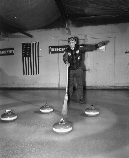 Walter C. Rhodes All-Midwest Curling Skipper Walter C. Rhodes, member of the Madison Curling Club, was chosen by officers of the Midwest Curling Association to skip the All-Midwest Rink in the Canadian Branch of The Royal Caledonian Curling Club's One Hundredth Birthday Bonspiel to be staged in Montreal. He is posed on the ice with curling equipment.