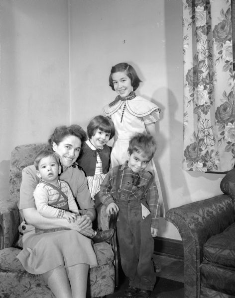 Mrs. John (Priscilla) Medler and her Four Children Group portrait of Mrs. John (Priscilla) Medler and four of her five children. Seated on her lap is Melvin, 18 months old. Standing left to right are: Marcia, five, Meredith, eleven, and Marc, three.