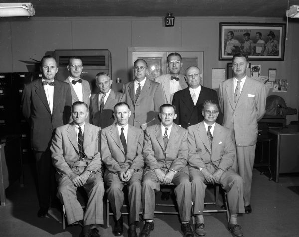 United Givers Fund Campaign Group portrait of the advance gifts division leaders for the 1953 United Givers Fund campaign. Standing, left to right: John w. Fish, Kenneth L. White, Ezra Frank, Eldon Russell, R. F. Stump, Charles Goulet, and Henry Behrnke. Seated, left to right: Charles Ellis, Leslie K. Pollard, Wilbur Bakke, and Lucien S. Hanks.