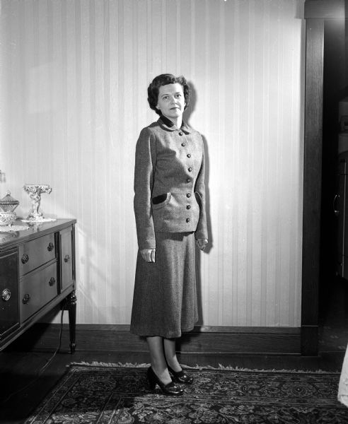 Elizabeth Miller Modeling Suit Elizabeth (Mrs. Howard C.) Miller models a French-style suit she made. The photograph was taken to accompany an article about Elizabeth's seamstress work for herself and her daughter.