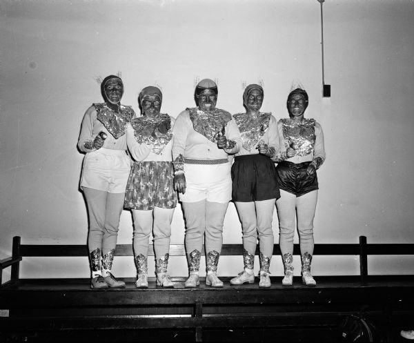 The Business Women's Bowling League staged its first annual dress-up bowling sessions at the Plaza Alleys. Included are Bea Hein, Lorene Kerie, Kelly Butterworth, Dee Fix and Marcy Olson, all dressed as space women.