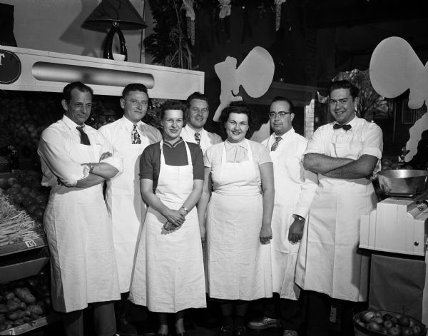 Hi-Lo Super Market Staff Portrait of seven staff members, possibly including Robert E. Girard, at the Hi-Lo Super Market at 2038 Jenifer Street.
