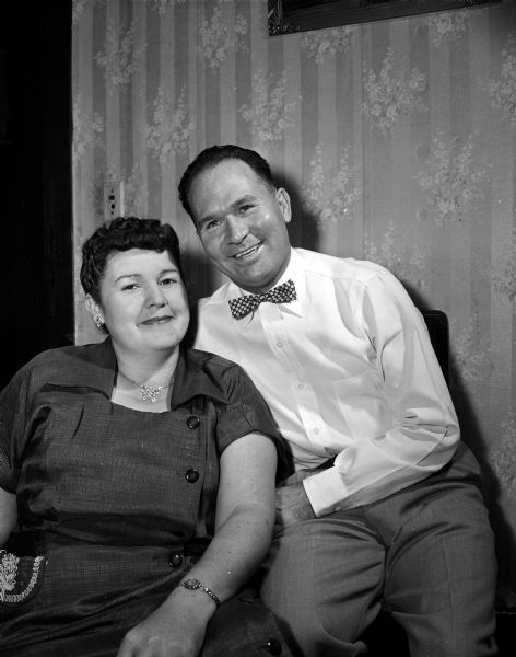 Capps and National Food Stores Helen and Cleo Capps won a 17-inch television set for their ideas about why it is pleasant to shop at National Food Stores. The photograph was taken as an advertisement for the store chain.