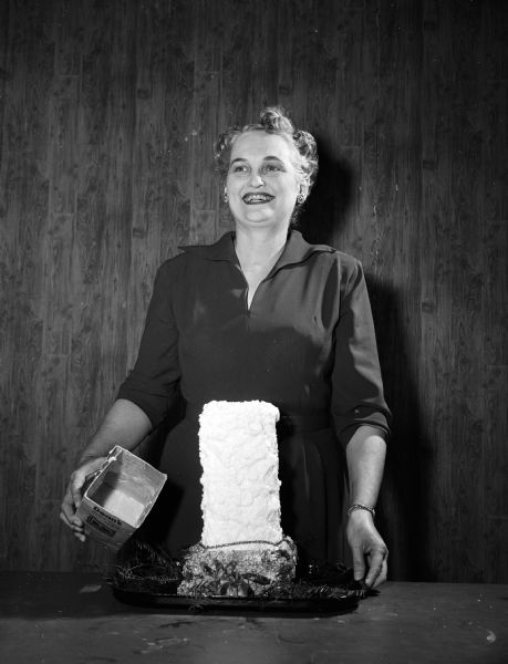 Portrait of Fern Fowler, WMTV show host, with Christmas candles that she made.