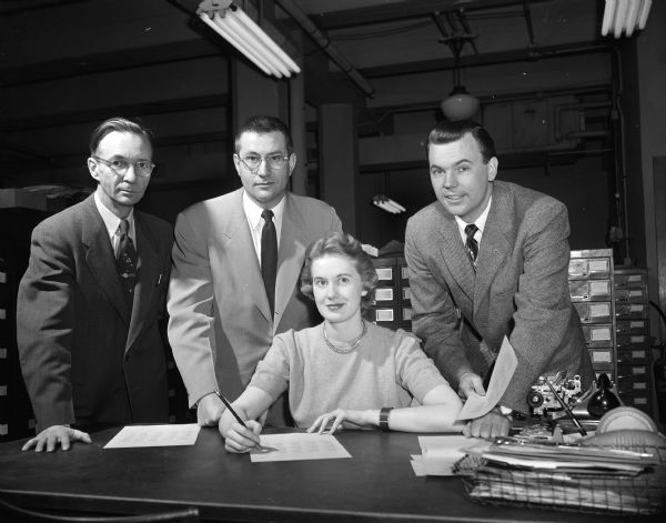 Madison Spelling Bee Officials Madison Spelling Bee Officials prepare for the up-coming spelling bee. They are, from left to right, Francis Clawson, Rev. Sig G. Sandrock, Nancy Stoufenraus, and Bob Dick.
