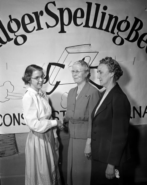 Badger Spelling Bee Winner With Teachers Judy Fiedler, Franklin School student and winner of the Badger Spelling Bee, poses with two teachers. Laura Reed (left) is Fiedler's spelling teacher and Cecelia Bartholomew is her homeroom teacher.