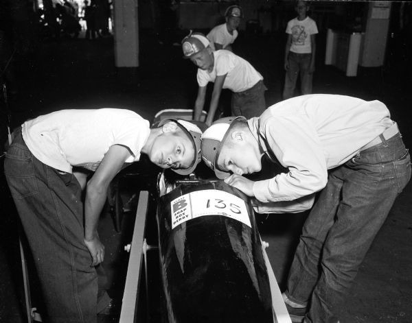 Madison Soap Box Derby David Laverty, age 11, inspects a Soap Box Derby car with his friend, Bobby Swenson, 12. The boys are from Mineral Point, Wisconsin.