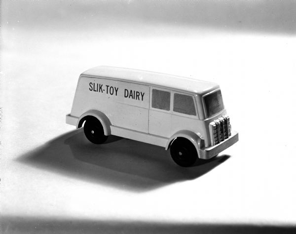 Toy Trucks and Tractors Studio photograph of a "Slik-Toy Dairy" toy truck against a white background.