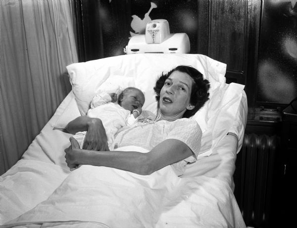 Christmas Baby Mrs. Harvey Johnson holds her new baby girl, born on Christmas day at St. Mary's Hospital.