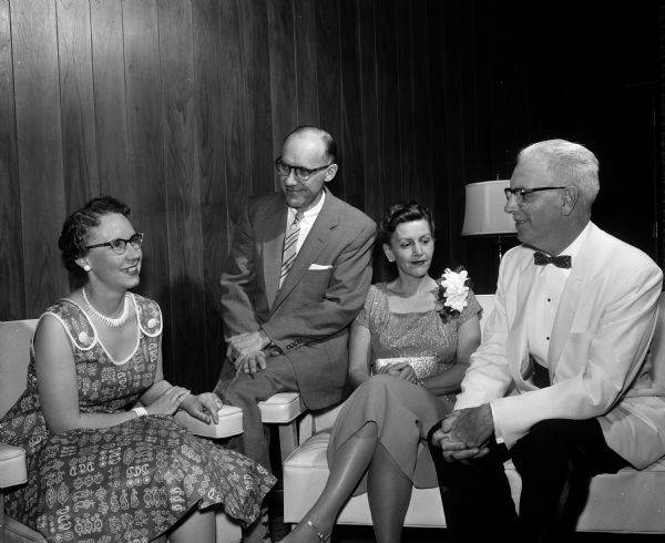 Cosmos Club Dinner Dance Two couples visit at the Cosmos Club dinner dance. Left to right: Delta and Herbert Woinowski and Sarah and Cedric Smith.