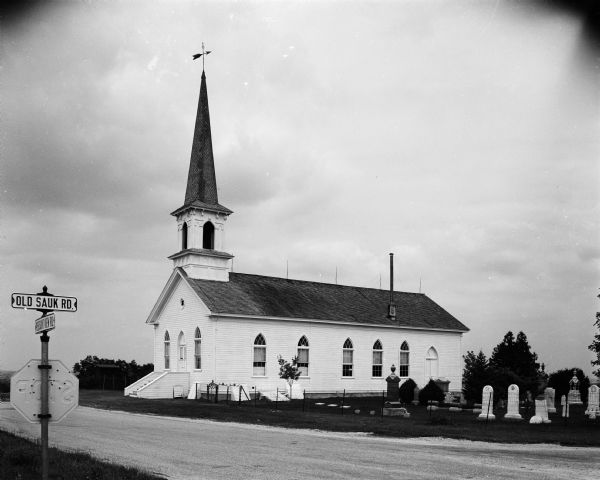 Exterior view of the First Lutheran Church at the corner of Old Sauk Road and Pleasant View Road in Middleton, Wisconsin. It was the site of the Middleton Garden Club flower show and the starting point of their country home tour.

The church marked its centennial in 1952. As of 1956, regular Sunday services had been discontinued but an annual reunion service was held each fall.