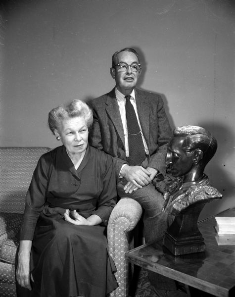 Dr. Thomas A. Leonard has served as a visiting professor of obstetrics and gynecology at the University of Vera Cruz in Mexico. Dr. and Mrs. Leonard visit a new area of Mexico each year. They are shown with a carved wooden bust of Manolete, a famous Mexican bullfighter, a gift from Mexican friends.