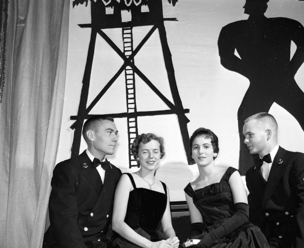 Two couples attend the Navy Ball held for the Naval Reserve Officers Training Corps (NROTC) midshipmen at the Memorial Union's Great Hall. They are Henry Tease (Green Bay) and Barbara Taylor (Rhinelander) on the left, and LaVerne West (Racine) and Jim Hansen (Racine) on the right.