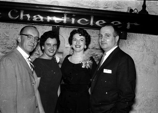 Doctors and medical assistants attend the annual Bosses Night party. From left to right are: Dr. Frank Bernard, Peg Clark, Mary Macken, and Dr. Gordon Davenport.
