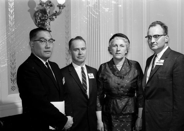 Newly elected officers of the State Commission on Human Rights. "They are, left to right, the Rev. Perry Saito, pastor of St. Paul's Methodist Church, Stevens Point, second vice-president; Dr. G. Aubrey Young, pastor of the First Presbyterian Church, Waukesha, chairman; Dean Stella Pederson, Wisconsin State College, Eau Claire, secretary; and Victor I. Minahan Jr., editor of the <i>Appleton Post Crescent</i>, first vice-president."