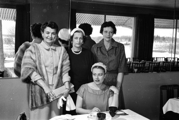 Among the guests at the luncheon at Nob Hill of the Ladies' Golf-Bowling League were Marian Nelson, seated, and standing, from left to right: Virgel Houghton, Claire Van Sistine, and Edith Barnes.