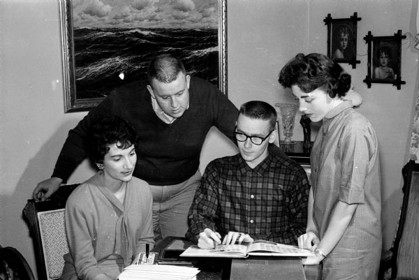 Four members of the Edgewood High school class of 1954 plan their fifth reunion. From left are: Eileen Weiss, Frank Kellogg, John Purcell, and Mrs. Virginia Renard.