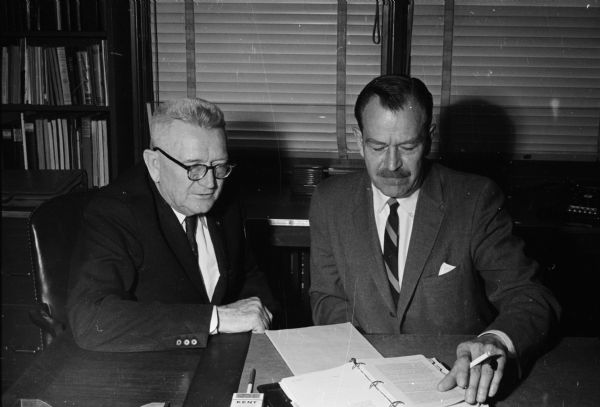 Lieutenant General Lewis B. Hershey (left), national selective service director, confers with his Wisconsin counterpart, Colonel Bentley Courtenay.